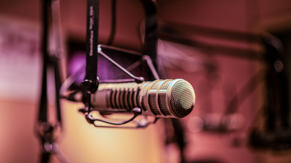 Vintage microphone in a recording studio, representing a human voice actor session