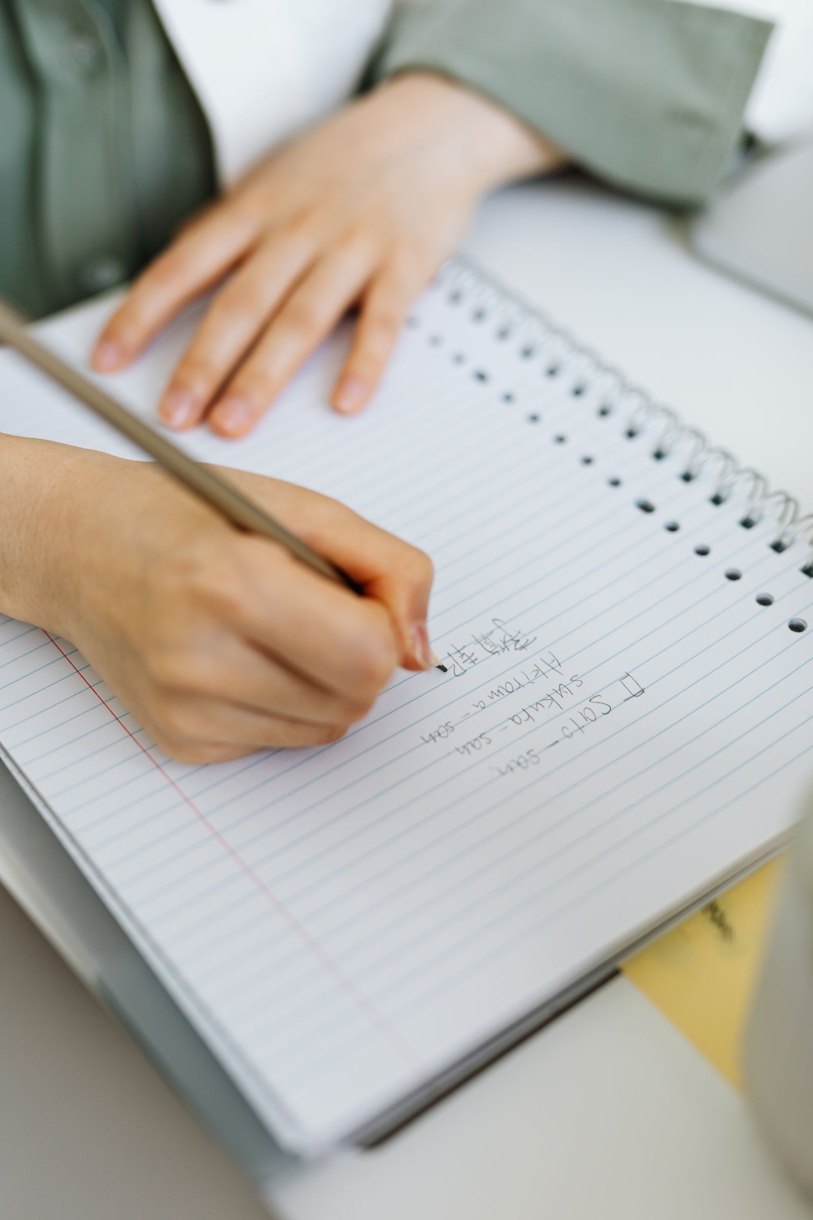 A person planning presentation sections on sticky notes and a screen