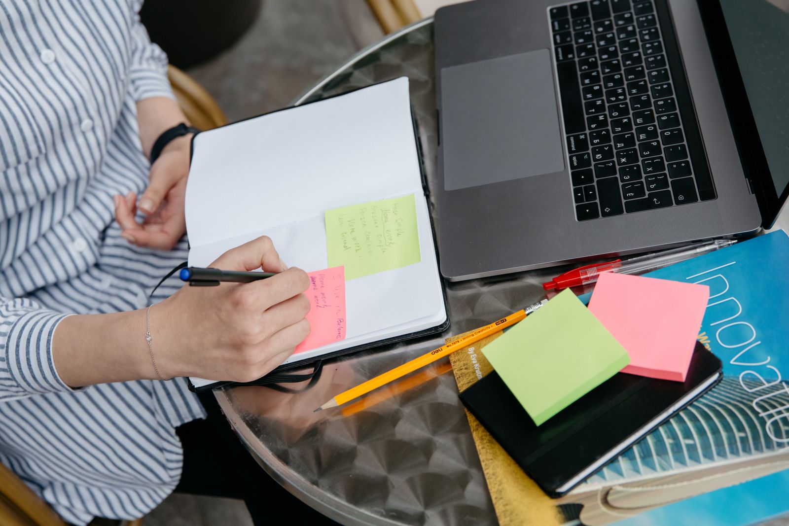 A person reviewing and rearranging a document structure on a laptop
