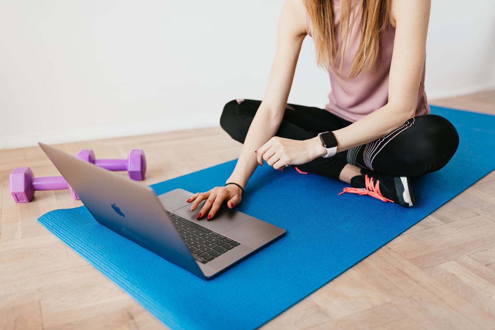 A person following an online training module on a laptop at home
