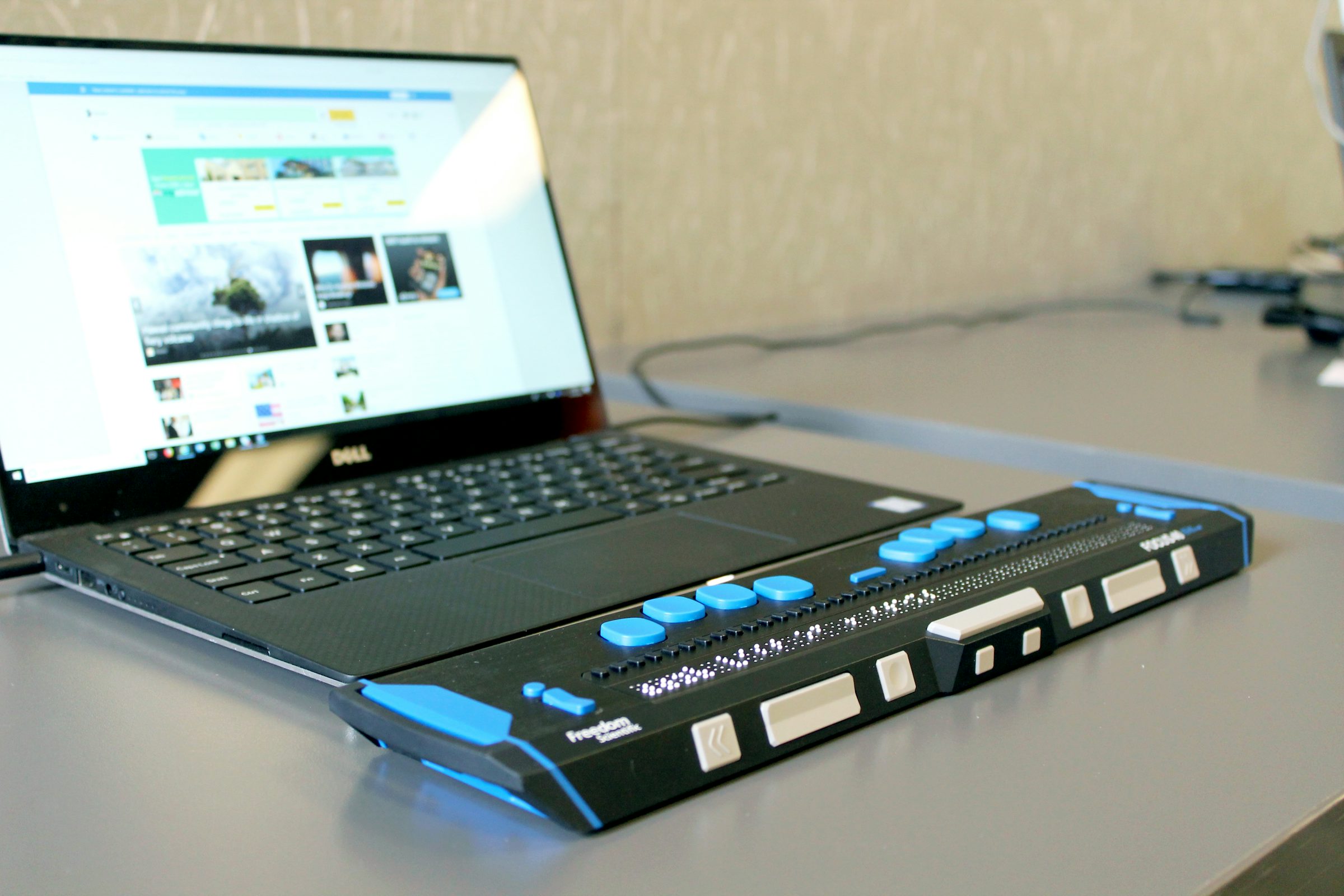 Laptop computer on a desk, representing AI voice accessibility tools like screen readers and text-to-speech