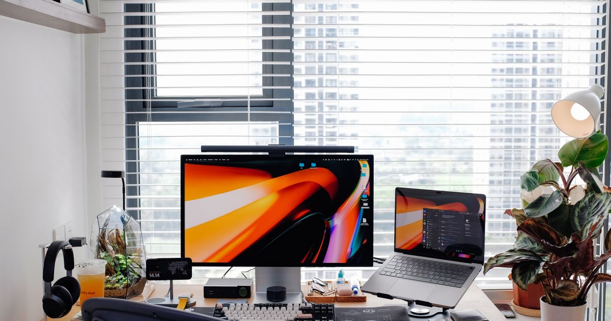 A clean desk with a laptop ready for making AI presentation slides for free