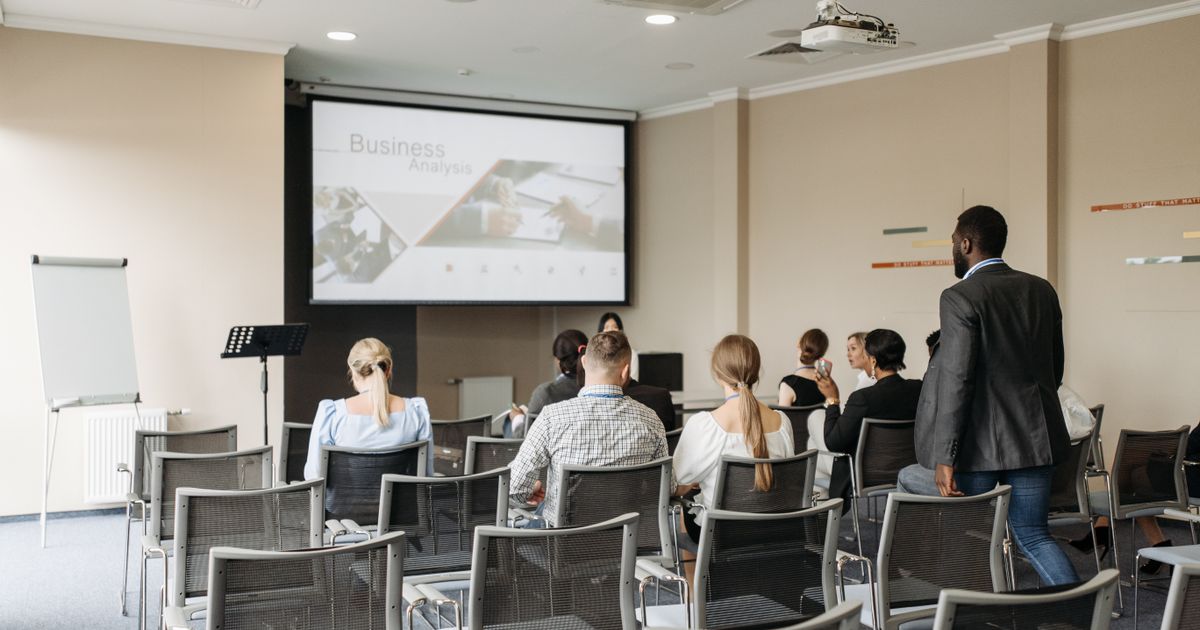 People in a meeting viewing a presentation created with ChatGPT