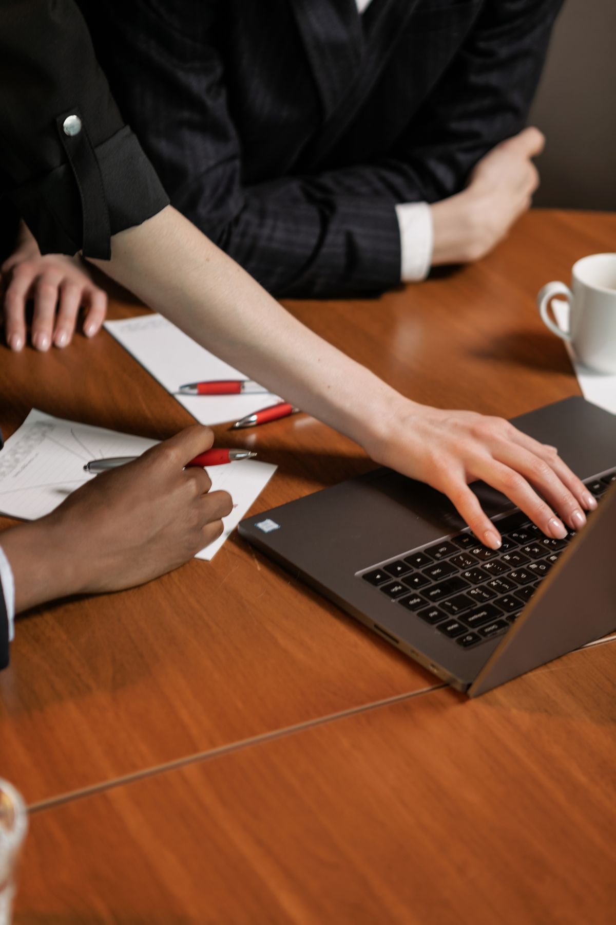A person reviewing branded presentation slides on a laptop