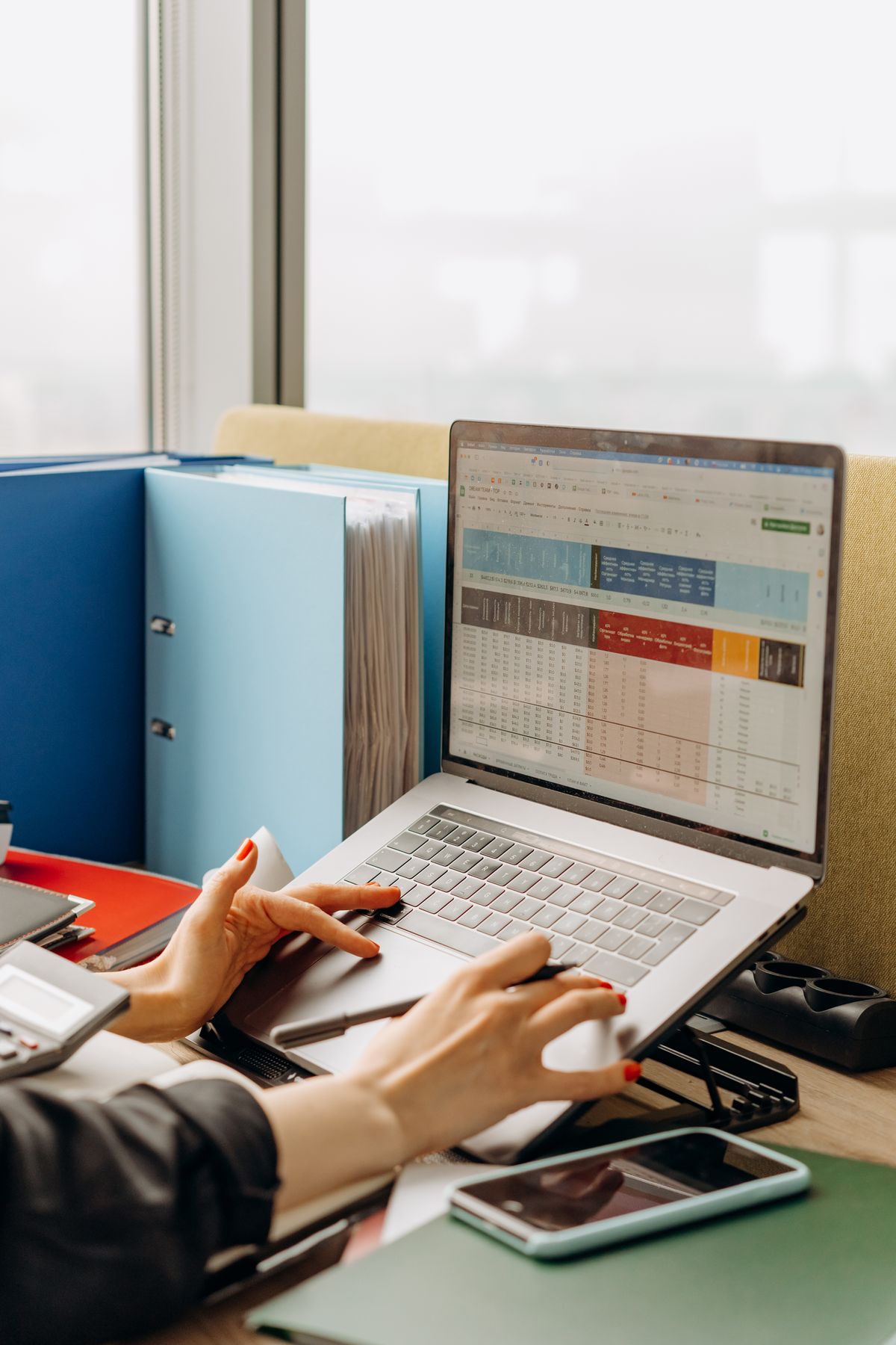 A laptop showing spreadsheet data being analyzed for a presentation