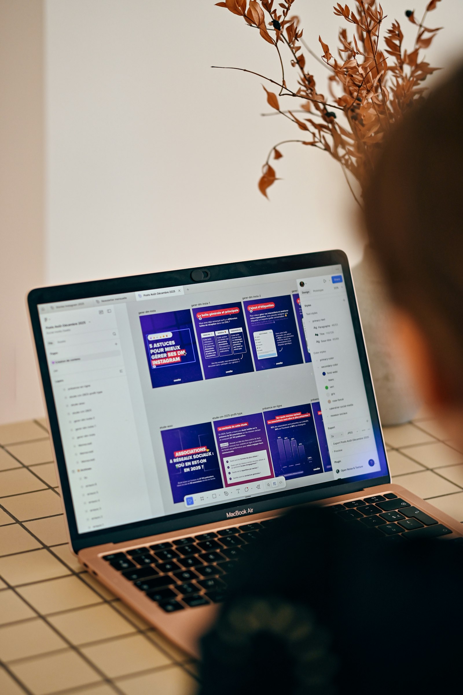Person looking at a laptop screen with AI-generated presentation slides