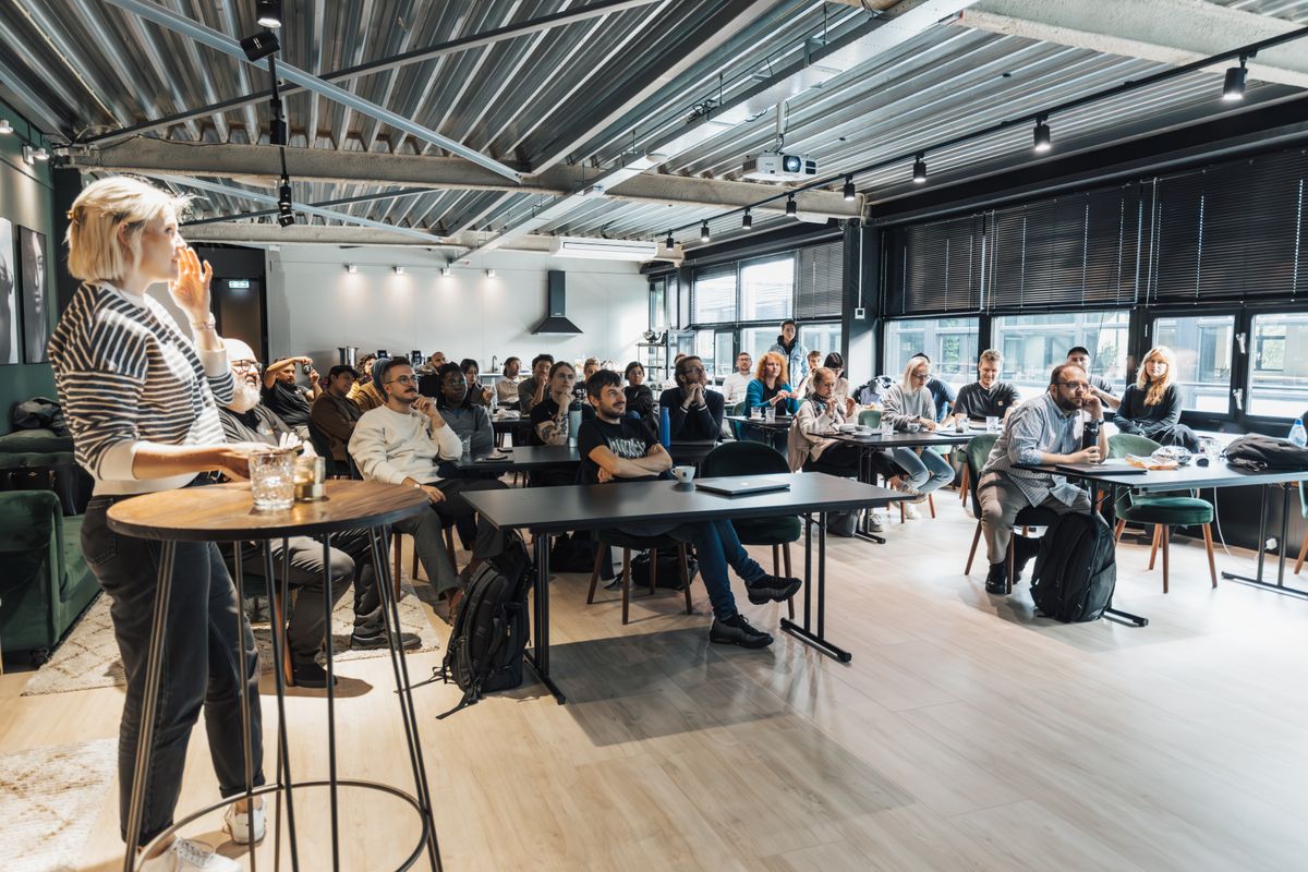 An attentive audience watching an engaging presentation in a modern room