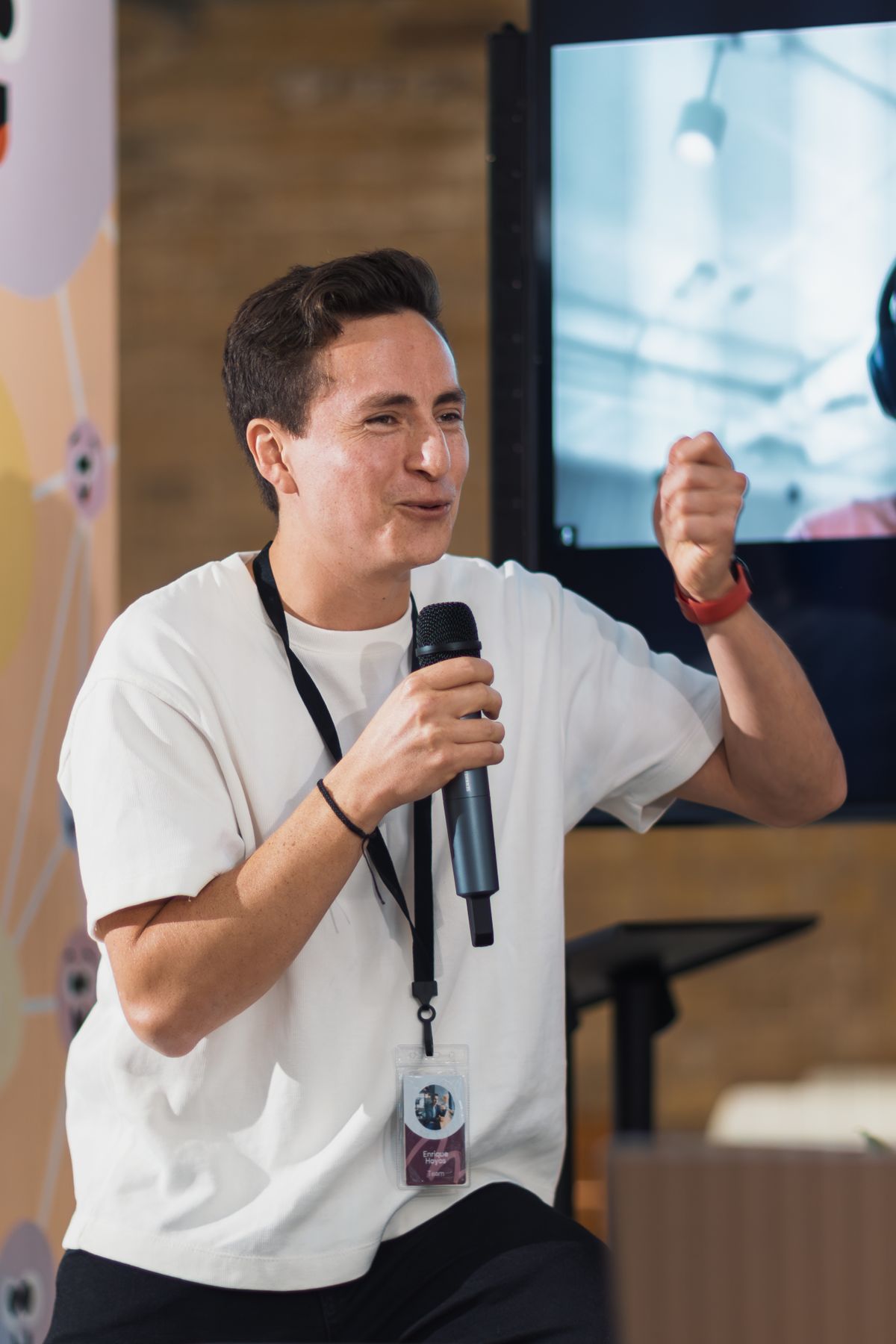 A speaker presenting research to an audience at a conference