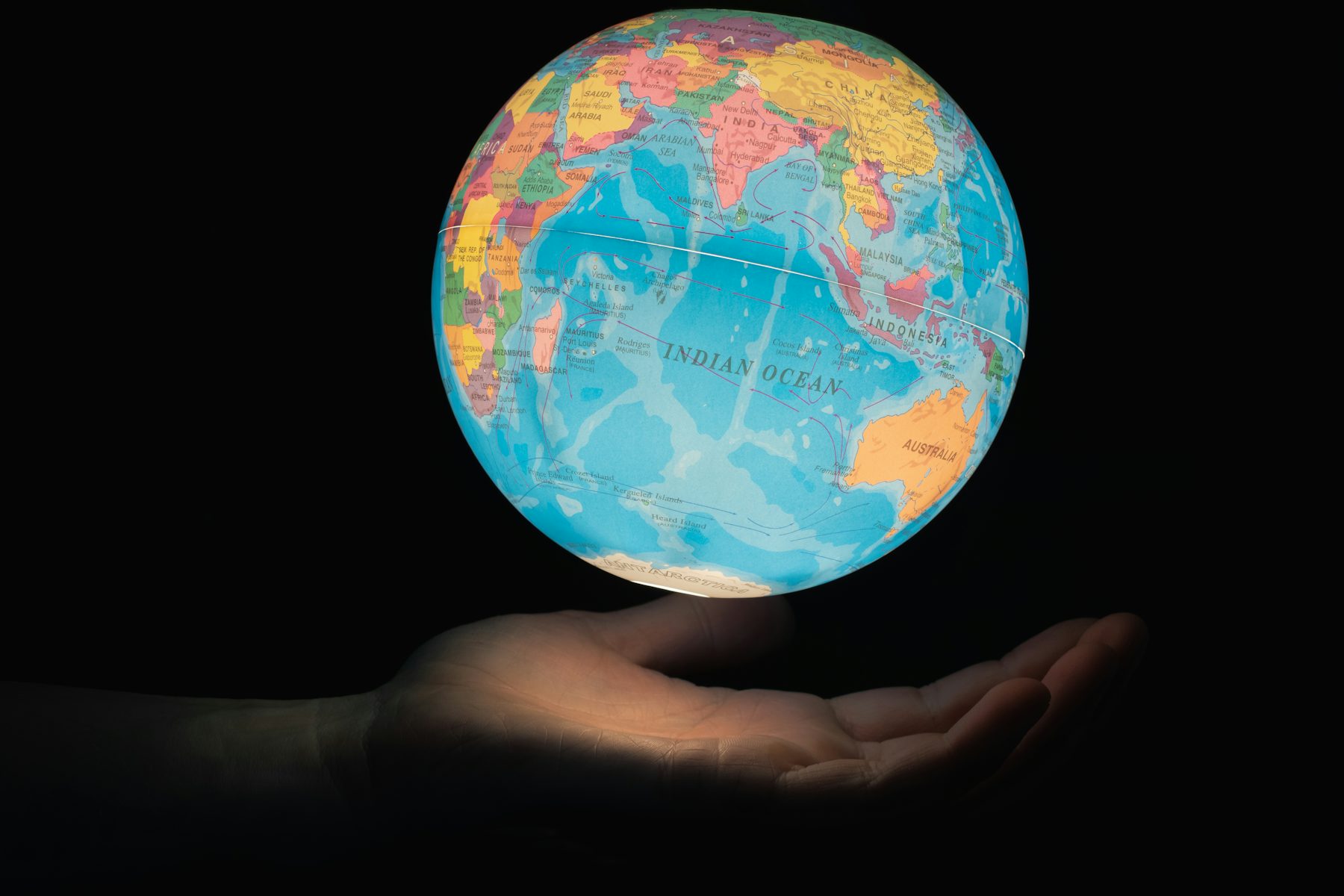 Blue and brown desk globe, representing the many languages covered by AI voice generators