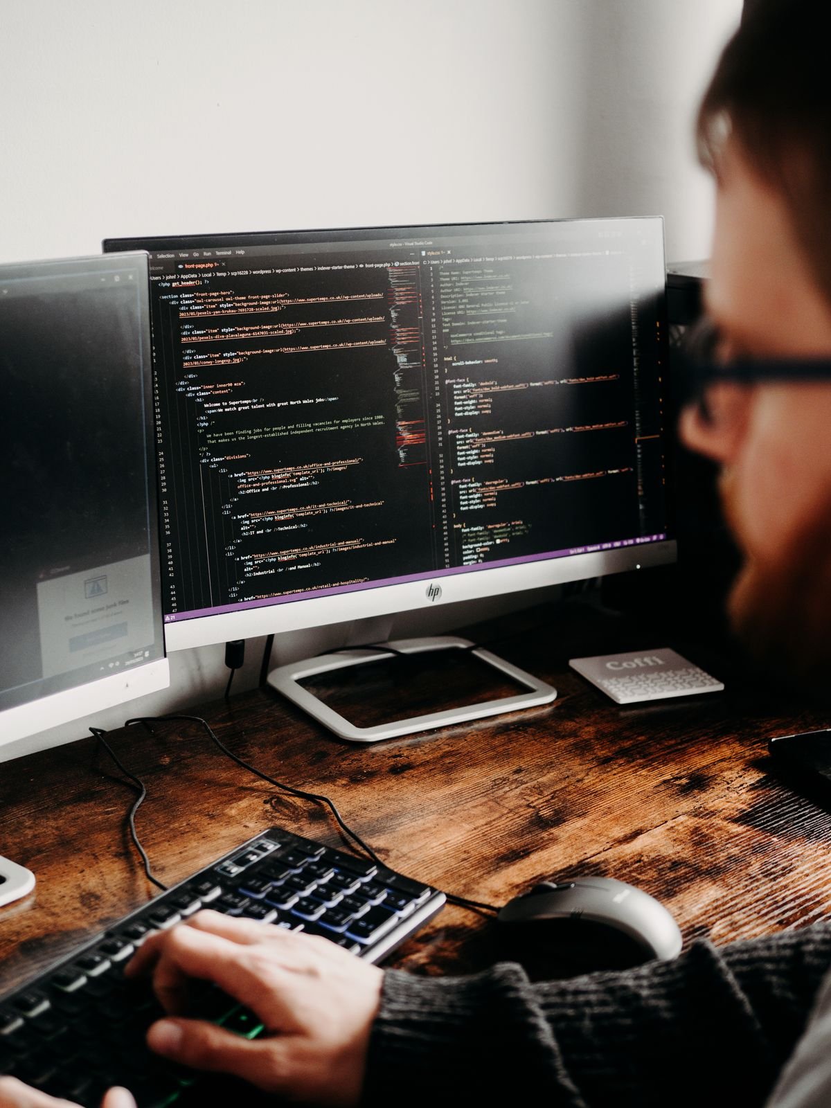 A developer coding on a PC, a common setup for engineering AI assistants
