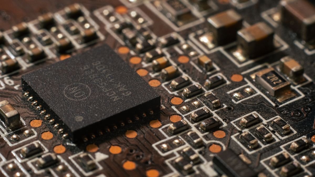 Macro close-up of a circuit board with a labeled ON Semiconductor chip and surrounding components