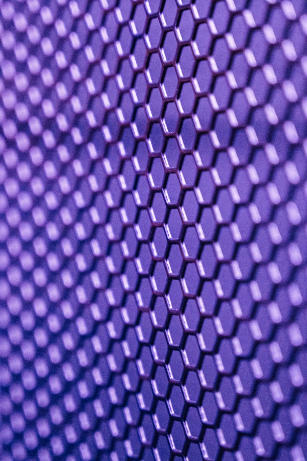 A complex geometric metal lattice pattern evoking generative design output