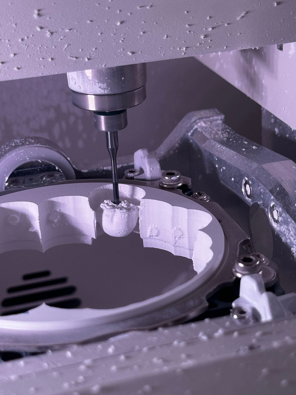 A CNC milling machine cutting a precision metal component