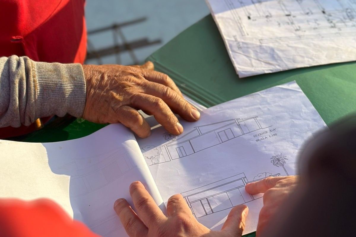 Team of engineers reviewing blueprints together in an office